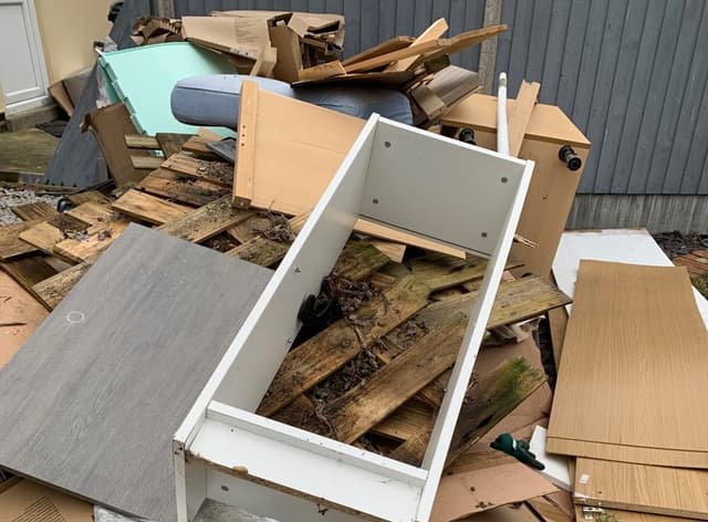 pile of household rubbish and bulky waste outside property in Lewisham