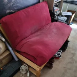 old red futon removed and disposed